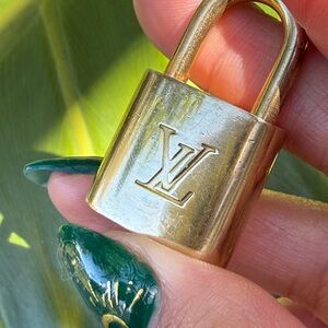 Louis Vuitton Gold Padlock with key Engraved Logo